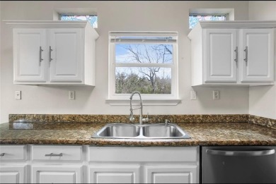 This stunning two story is perfectly situated between Shadow on White Bluff Resort - New Course in Texas - for sale on GolfHomes.com, golf home, golf lot