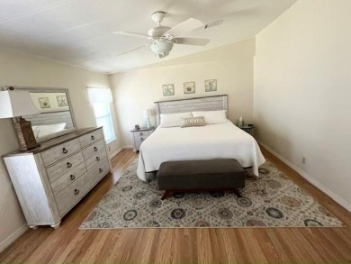 Beautifully maintained open-concept 2-bd/2-ba home is situated on Del Tura Golf and Country Club in Florida - for sale on GolfHomes.com, golf home, golf lot