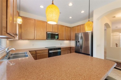 For sale is a charming Melody model nestled in a serene on Stonegate Golf Club in Florida - for sale on GolfHomes.com, golf home, golf lot