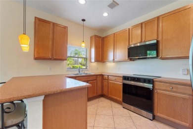 For sale is a charming Melody model nestled in a serene on Stonegate Golf Club in Florida - for sale on GolfHomes.com, golf home, golf lot