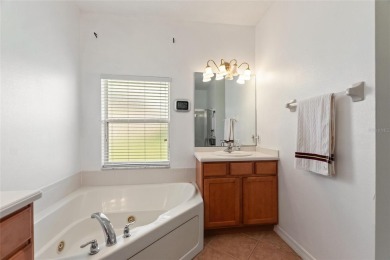 For sale is a charming Melody model nestled in a serene on Stonegate Golf Club in Florida - for sale on GolfHomes.com, golf home, golf lot