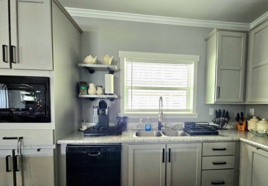 This 2020 farmhouse in Cypress Lakes Village offers 2 bedrooms on Big Cypress Golf and Country Club in Florida - for sale on GolfHomes.com, golf home, golf lot