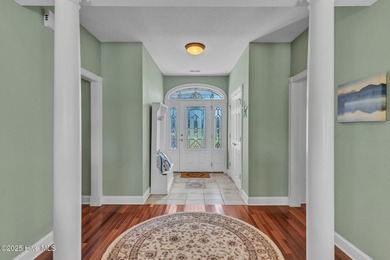 Welcome home! This 3-bedroom, 2.5-bath house sits under a canopy on The Carolina Club in North Carolina - for sale on GolfHomes.com, golf home, golf lot