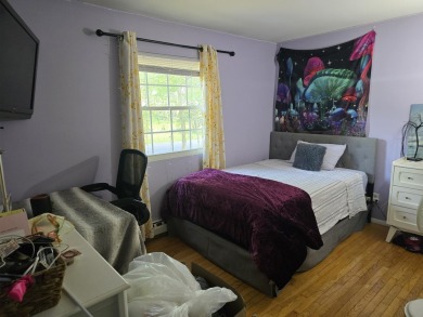 This 4 bedroom, 2 bath split level home sits in an amenity on Pocono Farms Country Club in Pennsylvania - for sale on GolfHomes.com, golf home, golf lot