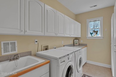 Welcome home! This 3-bedroom, 2.5-bath house sits under a canopy on The Carolina Club in North Carolina - for sale on GolfHomes.com, golf home, golf lot