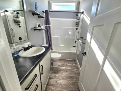 This 2020 farmhouse in Cypress Lakes Village offers 2 bedrooms on Big Cypress Golf and Country Club in Florida - for sale on GolfHomes.com, golf home, golf lot