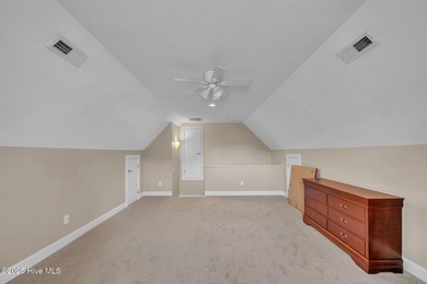 Welcome home! This 3-bedroom, 2.5-bath house sits under a canopy on The Carolina Club in North Carolina - for sale on GolfHomes.com, golf home, golf lot