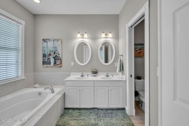 Welcome home! This 3-bedroom, 2.5-bath house sits under a canopy on The Carolina Club in North Carolina - for sale on GolfHomes.com, golf home, golf lot