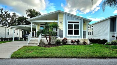 This 2020 farmhouse in Cypress Lakes Village offers 2 bedrooms on Big Cypress Golf and Country Club in Florida - for sale on GolfHomes.com, golf home, golf lot