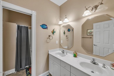 Welcome home! This 3-bedroom, 2.5-bath house sits under a canopy on The Carolina Club in North Carolina - for sale on GolfHomes.com, golf home, golf lot