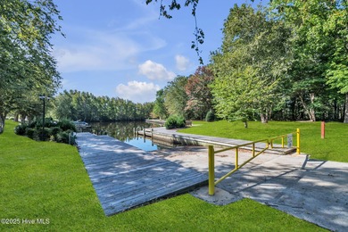 Welcome home! This 3-bedroom, 2.5-bath house sits under a canopy on The Carolina Club in North Carolina - for sale on GolfHomes.com, golf home, golf lot