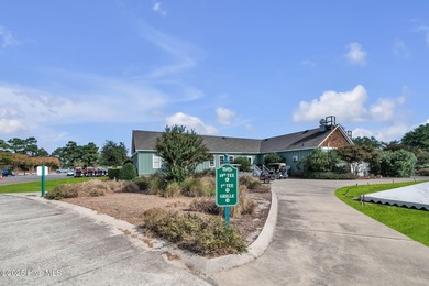 Welcome home! This 3-bedroom, 2.5-bath house sits under a canopy on The Carolina Club in North Carolina - for sale on GolfHomes.com, golf home, golf lot