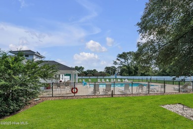 Welcome home! This 3-bedroom, 2.5-bath house sits under a canopy on The Carolina Club in North Carolina - for sale on GolfHomes.com, golf home, golf lot