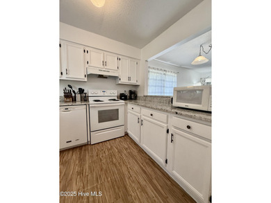 This first floor St. Andrews 2-bedroom, 2-bathroom lakefront on Pinehurst Resort and Country Club in North Carolina - for sale on GolfHomes.com, golf home, golf lot