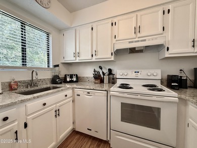 This first floor St. Andrews 2-bedroom, 2-bathroom lakefront on Pinehurst Resort and Country Club in North Carolina - for sale on GolfHomes.com, golf home, golf lot