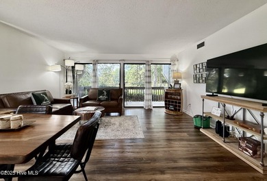 This first floor St. Andrews 2-bedroom, 2-bathroom lakefront on Pinehurst Resort and Country Club in North Carolina - for sale on GolfHomes.com, golf home, golf lot