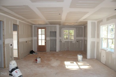 Experience the ultimate resort lifestyle in this move-in ready on River Golf and Country Club at Lake Royale in North Carolina - for sale on GolfHomes.com, golf home, golf lot