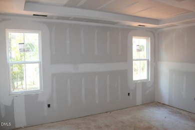 Experience the ultimate resort lifestyle in this move-in ready on River Golf and Country Club at Lake Royale in North Carolina - for sale on GolfHomes.com, golf home, golf lot