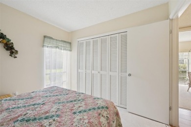 This one is a gem! With stylish finishes, wood flooring, cozy on Palm Aire Country Club of Sarasota in Florida - for sale on GolfHomes.com, golf home, golf lot