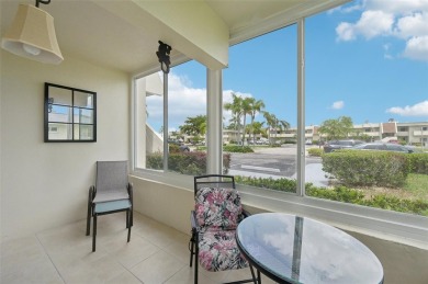 This one is a gem! With stylish finishes, wood flooring, cozy on Palm Aire Country Club of Sarasota in Florida - for sale on GolfHomes.com, golf home, golf lot