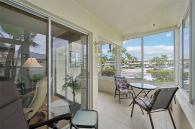 This one is a gem! With stylish finishes, wood flooring, cozy on Palm Aire Country Club of Sarasota in Florida - for sale on GolfHomes.com, golf home, golf lot