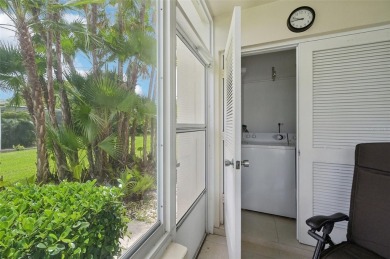 This one is a gem! With stylish finishes, wood flooring, cozy on Palm Aire Country Club of Sarasota in Florida - for sale on GolfHomes.com, golf home, golf lot