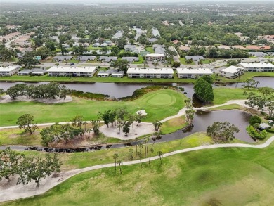 This one is a gem! With stylish finishes, wood flooring, cozy on Palm Aire Country Club of Sarasota in Florida - for sale on GolfHomes.com, golf home, golf lot