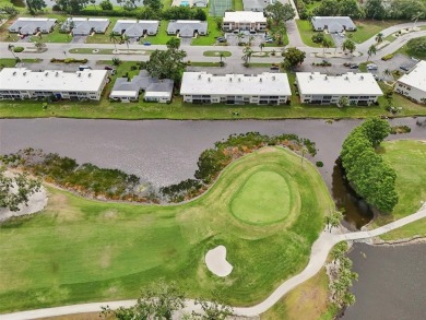 This one is a gem! With stylish finishes, wood flooring, cozy on Palm Aire Country Club of Sarasota in Florida - for sale on GolfHomes.com, golf home, golf lot