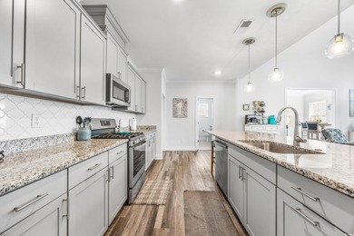 Discover luxury coastal living in this 5-bedroom, 3.5-bath on Surf Golf and Beach Club in South Carolina - for sale on GolfHomes.com, golf home, golf lot