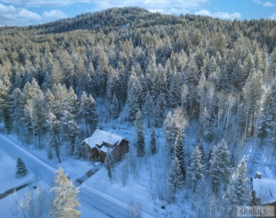 Discover this rare elevated cabin lot in one of the few areas of on Teton Springs Resort and Club in Idaho - for sale on GolfHomes.com, golf home, golf lot