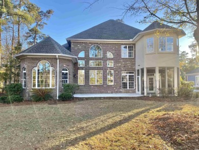 This spacious traditional home has volume ceilings throughout on Heron Point Golf Club in South Carolina - for sale on GolfHomes.com, golf home, golf lot