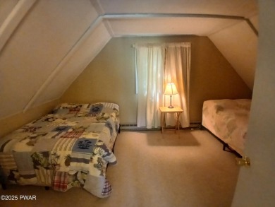 Escape to this delightful 3-bedroom, 1-bath chalet in the heart on The Hideout Golf in Pennsylvania - for sale on GolfHomes.com, golf home, golf lot