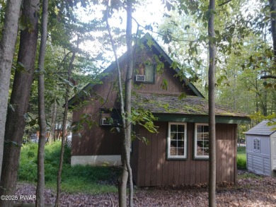 Escape to this delightful 3-bedroom, 1-bath chalet in the heart on The Hideout Golf in Pennsylvania - for sale on GolfHomes.com, golf home, golf lot