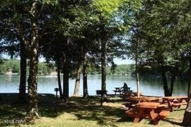 Escape to this delightful 3-bedroom, 1-bath chalet in the heart on The Hideout Golf in Pennsylvania - for sale on GolfHomes.com, golf home, golf lot