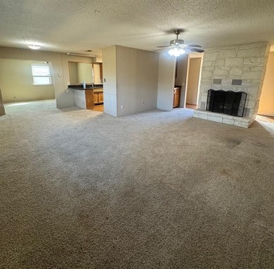 Great Investment Opportunity. Bring your decorating ideas to on De Cordova Bend Country Club in Texas - for sale on GolfHomes.com, golf home, golf lot