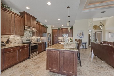 Welcome to this beautifully crafted DM Dean custom-built home on Seminole Lakes Country Club in Florida - for sale on GolfHomes.com, golf home, golf lot