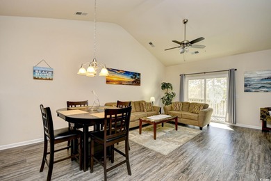 Discover coastal comfort in this well-appointed 2-bed, 2-bath on Barefoot Resort and Golf Club  in South Carolina - for sale on GolfHomes.com, golf home, golf lot