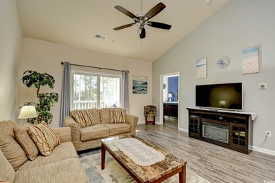 Discover coastal comfort in this well-appointed 2-bed, 2-bath on Barefoot Resort and Golf Club  in South Carolina - for sale on GolfHomes.com, golf home, golf lot