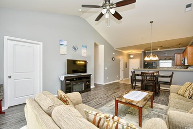 Discover coastal comfort in this well-appointed 2-bed, 2-bath on Barefoot Resort and Golf Club  in South Carolina - for sale on GolfHomes.com, golf home, golf lot