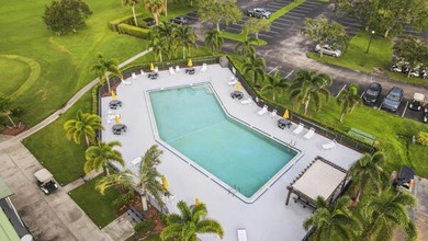 Don't miss this 1st floor unit on the 3rd hole of Gator Trace on Gator Trace Golf and Country Club in Florida - for sale on GolfHomes.com, golf home, golf lot