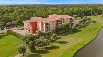 Don't miss this 1st floor unit on the 3rd hole of Gator Trace on Gator Trace Golf and Country Club in Florida - for sale on GolfHomes.com, golf home, golf lot