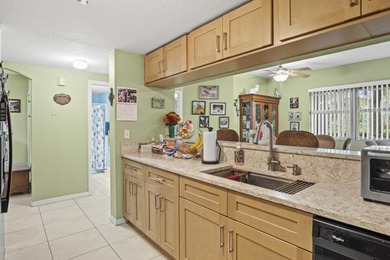 Don't miss this 1st floor unit on the 3rd hole of Gator Trace on Gator Trace Golf and Country Club in Florida - for sale on GolfHomes.com, golf home, golf lot