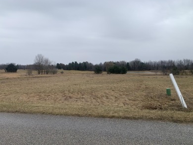 A beautiful building site overlooking the 7th hole and pond of on Eagle Glen Golf Course in Michigan - for sale on GolfHomes.com, golf home, golf lot