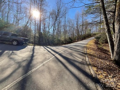 Corner lot bordering POA land. Spacious and buildable. Has on Connestee Falls Golf Club in North Carolina - for sale on GolfHomes.com, golf home, golf lot
