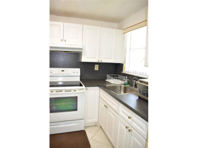 This is a well located ground floor unit with all tile floors, a on  in Florida - for sale on GolfHomes.com, golf home, golf lot