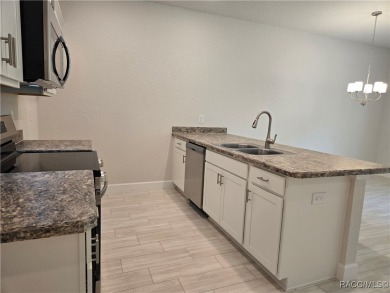 THE Palms Townhouse - Located in the Premier Gated, Lakeside on Inverness Golf and Country Club in Florida - for sale on GolfHomes.com, golf home, golf lot