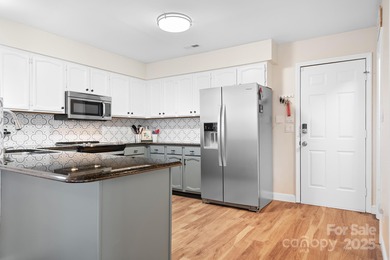 Discover your dream WATERFRONT contemporary home in the heart of on Tega Cay Golf Club in South Carolina - for sale on GolfHomes.com, golf home, golf lot