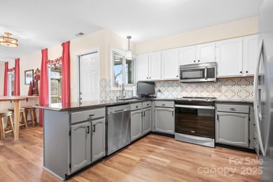 Discover your dream WATERFRONT contemporary home in the heart of on Tega Cay Golf Club in South Carolina - for sale on GolfHomes.com, golf home, golf lot