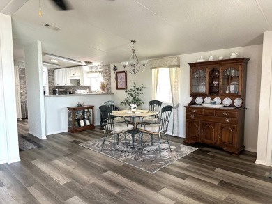 THIS 2-BEDROOM, 2-BATHROOM HOME HAS BEEN BEAUTIFULLY UPDATED AND on Anglers Green Golf Course in Florida - for sale on GolfHomes.com, golf home, golf lot