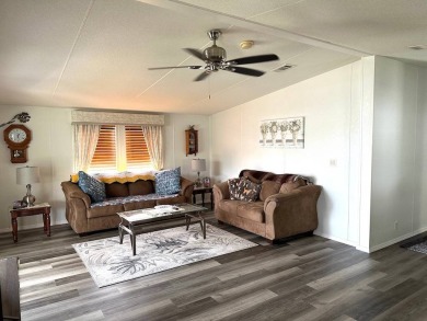 THIS 2-BEDROOM, 2-BATHROOM HOME HAS BEEN BEAUTIFULLY UPDATED AND on Anglers Green Golf Course in Florida - for sale on GolfHomes.com, golf home, golf lot